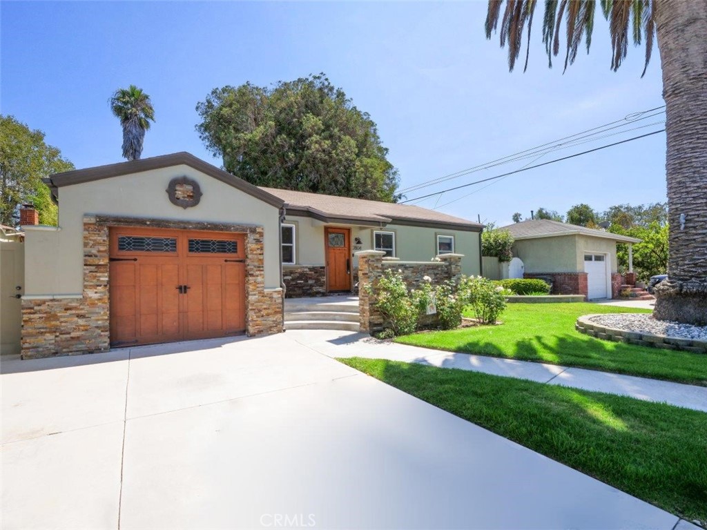 2804 Vail Avenue Redondo Beach, CA 90278 - Photo 3 of 29 a front view of a house with a yard and garage
