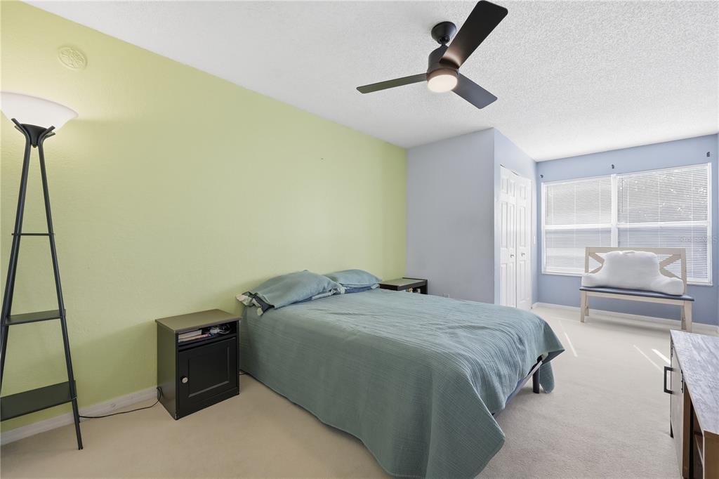 5108 Conroy Road, Unit 1724 Orlando, FL 32811 - Photo 21 of 40 a bedroom with a bed and a window