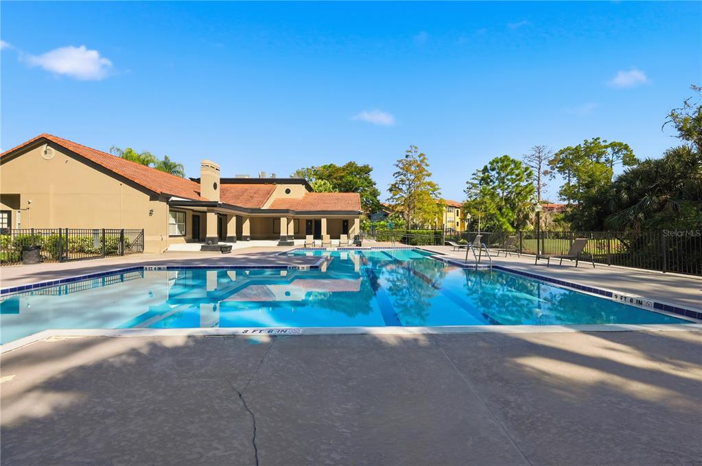 5108 Conroy Road, Unit 1724 Orlando, FL 32811 - Photo 25 of 40 a view of a house with pool and a yard
