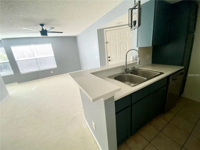 a kitchen with a sink and cabinets