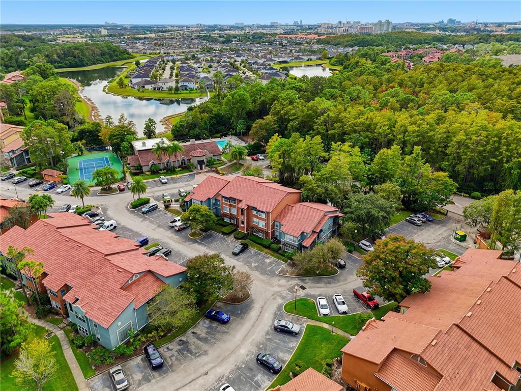 5108 Conroy Road, Unit 1724 Orlando, FL 32811 - Photo 35 of 40 an aerial view of residential houses with outdoor space and trees