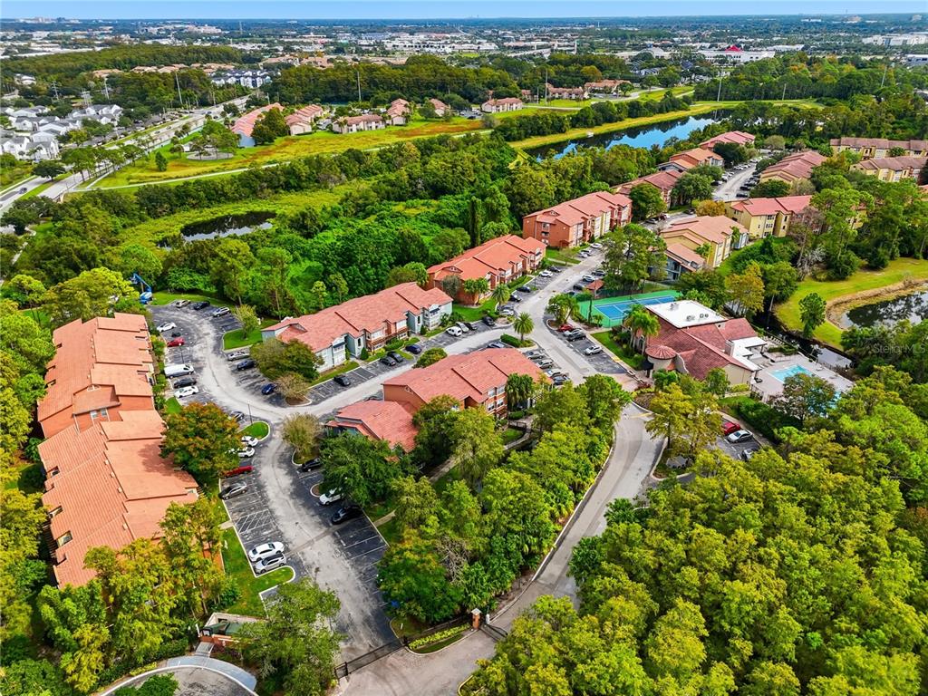 5108 Conroy Road, Unit 1724 Orlando, FL 32811 - Photo 38 of 40 an aerial view of residential houses with outdoor space
