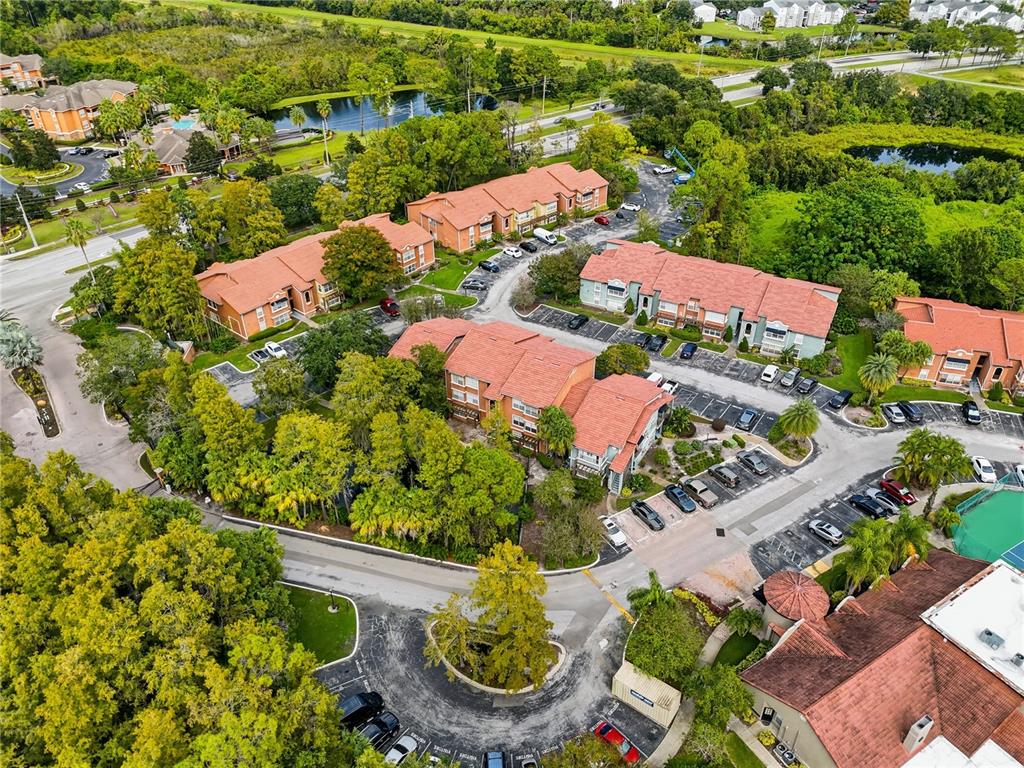 5108 Conroy Road, Unit 1724 Orlando, FL 32811 - Photo 39 of 40 an aerial view of residential houses with outdoor space and street view