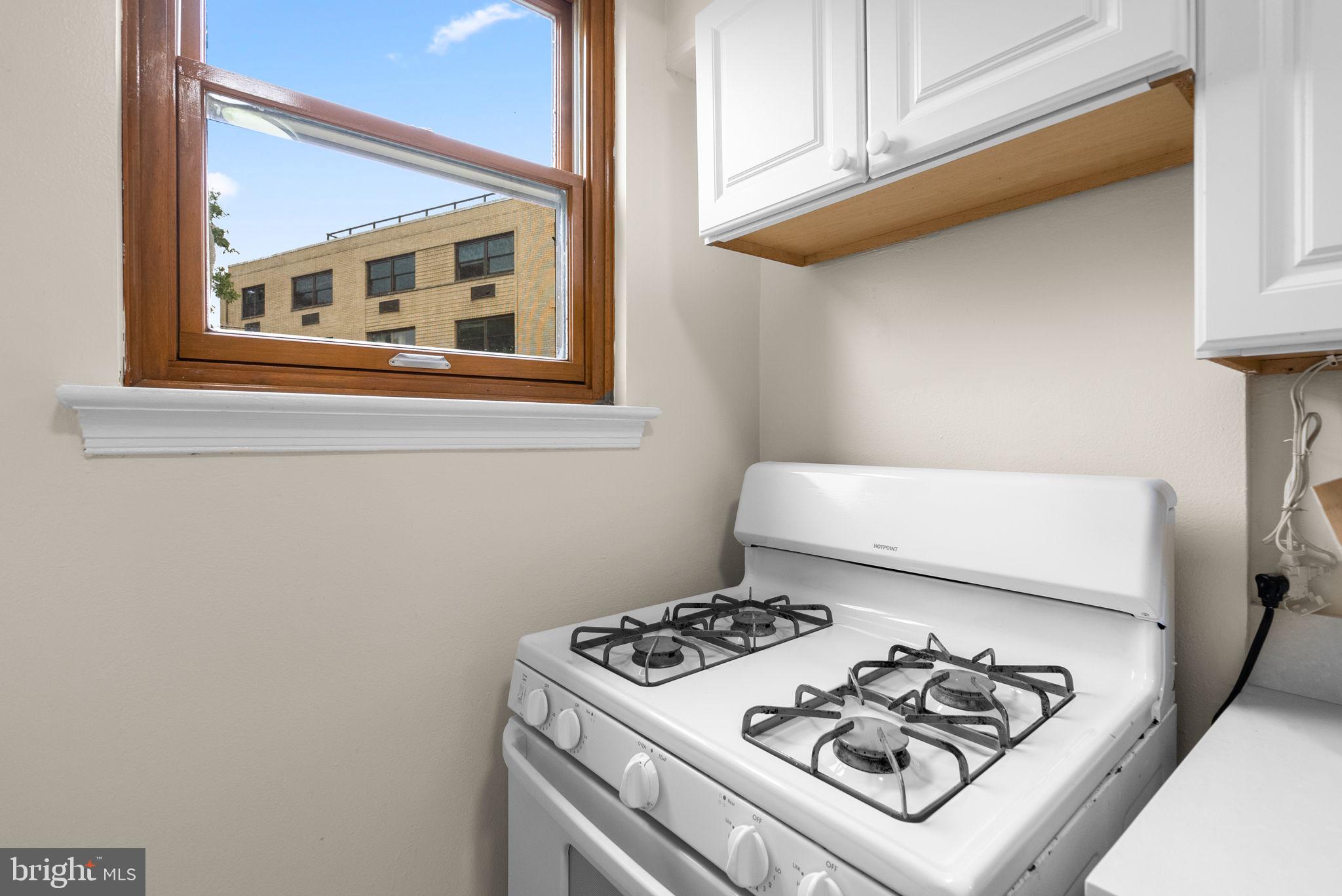 3025 Ontario Road Northwest, Unit 407 Washington, DC 20009 - Photo 19 of 28 Bright kitchen with a cozy view.