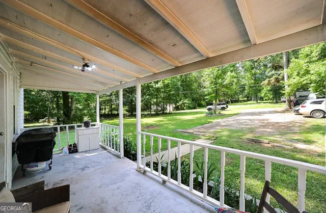a view of a porch and garden
