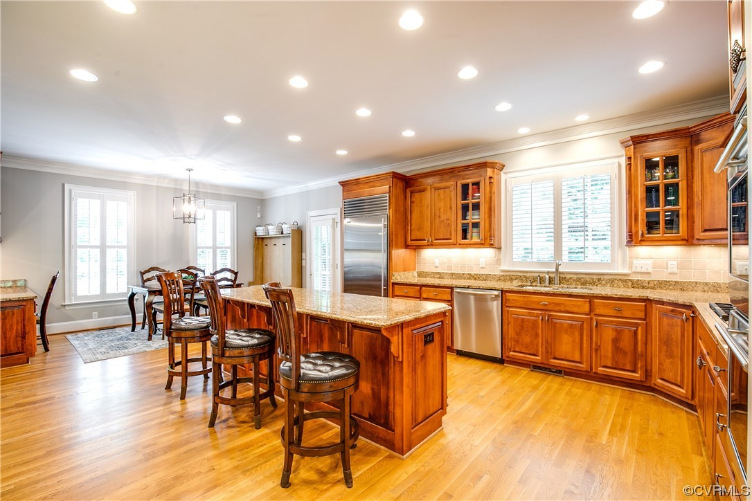 3631 Lansdowne Road Midlothian, VA 23113 - Photo 13 of 50 a kitchen with stainless steel appliances granite countertop dining table chairs and wooden floor
