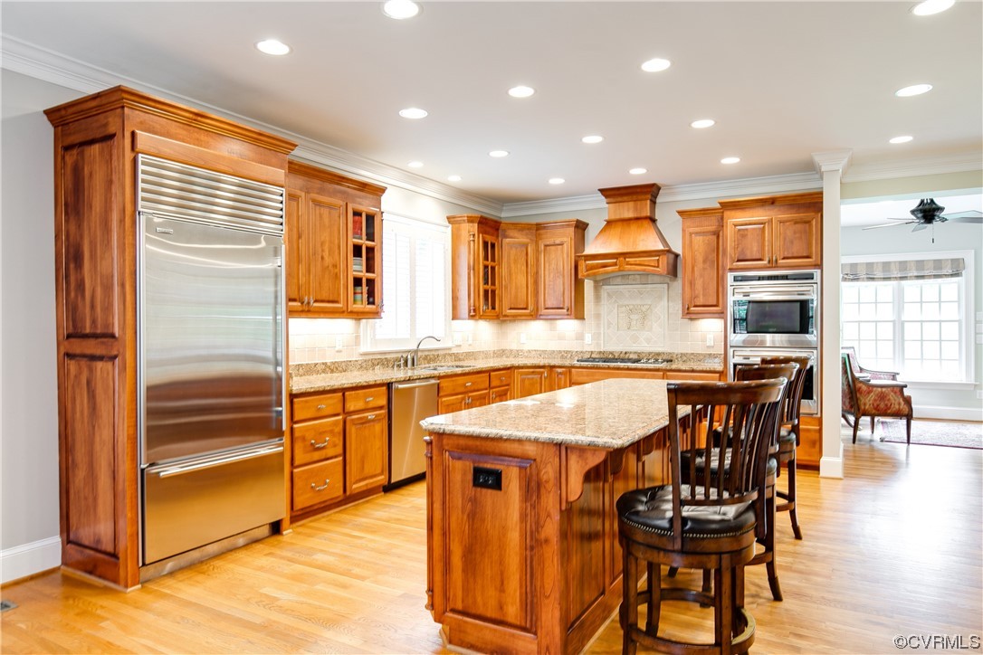 3631 Lansdowne Road Midlothian, VA 23113 - Photo 14 of 50 a kitchen with stainless steel appliances granite countertop table chairs sink and cabinets
