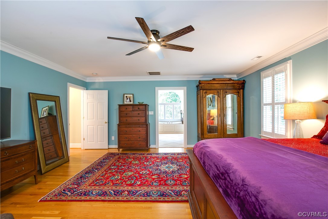 3631 Lansdowne Road Midlothian, VA 23113 - Photo 26 of 50 a bedroom with a large bed and a chandelier