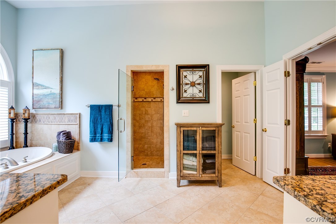 3631 Lansdowne Road Midlothian, VA 23113 - Photo 28 of 50 a spacious bedroom with a bed and a fireplace