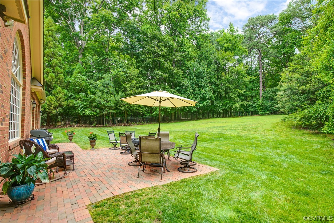 3631 Lansdowne Road Midlothian, VA 23113 - Photo 45 of 50 a view of a chair and table with umbrella in the garden