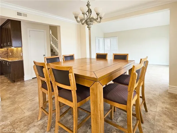 a view of a kitchen with dining area swimming pool and outdoor space