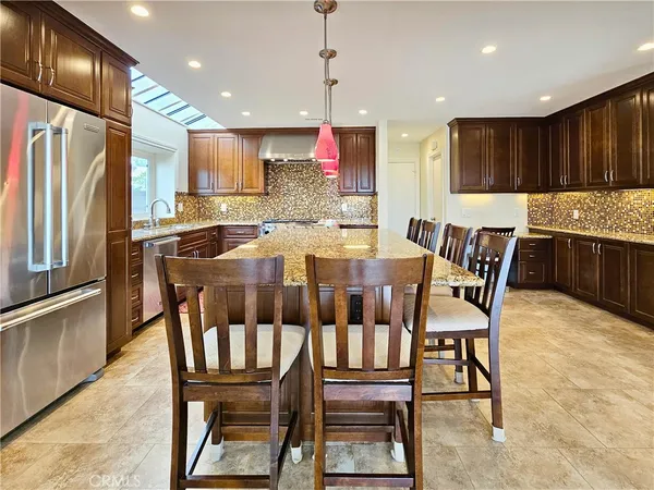 a stove top oven sitting inside of a kitchen