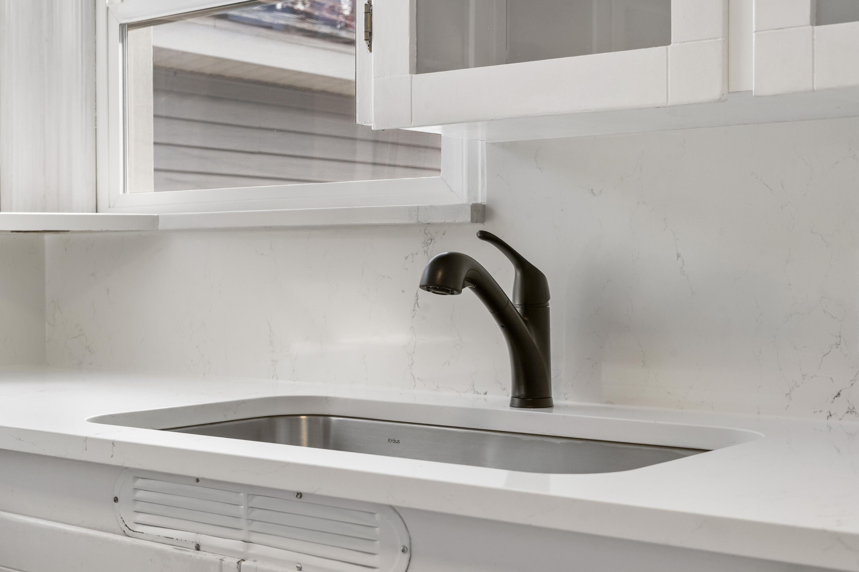 946 Southwest 13th Street Redmond, OR 97756 - Photo 11 of 49 a close view of sink and tap