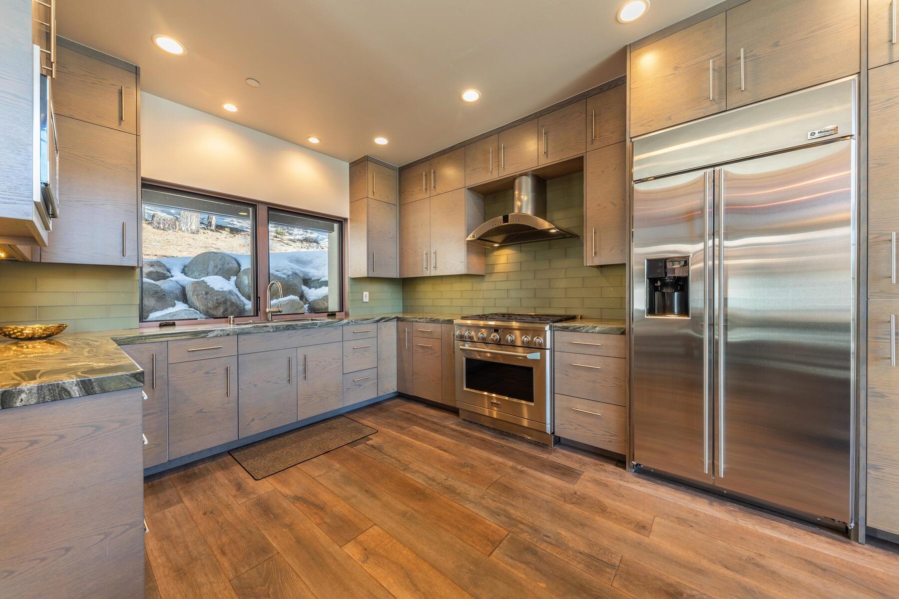 206 Shoshone Way Olympic Valley, CA 96146 - Photo 10 of 21 a kitchen with stainless steel appliances a stove a sink and a refrigerator