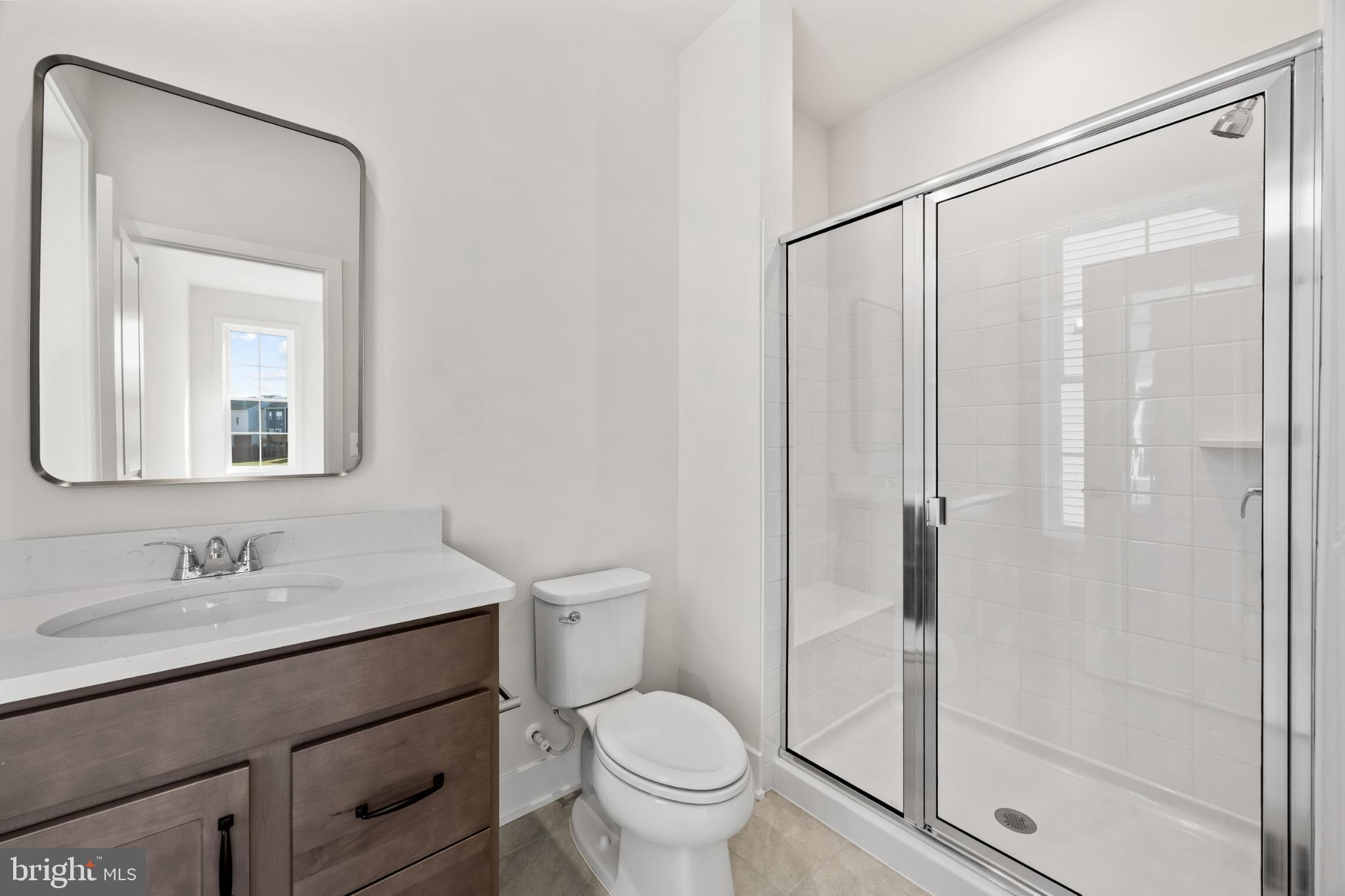 104 Alabaster Lane Stephenson, VA 22656 - Photo 24 of 41 a bathroom with a granite countertop sink toilet and shower