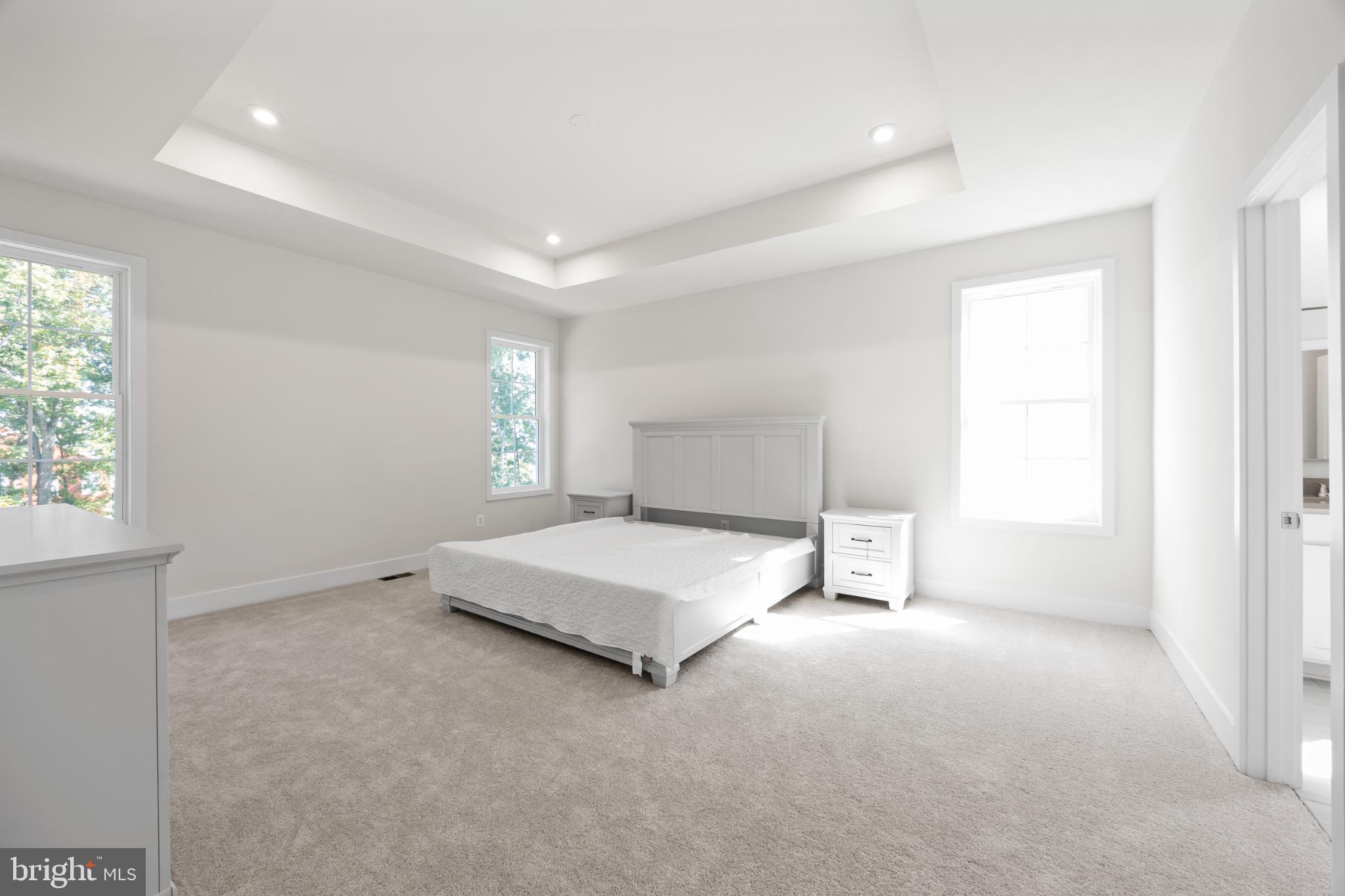 104 Alabaster Lane Stephenson, VA 22656 - Photo 30 of 41 a spacious bedroom with a bed and a window