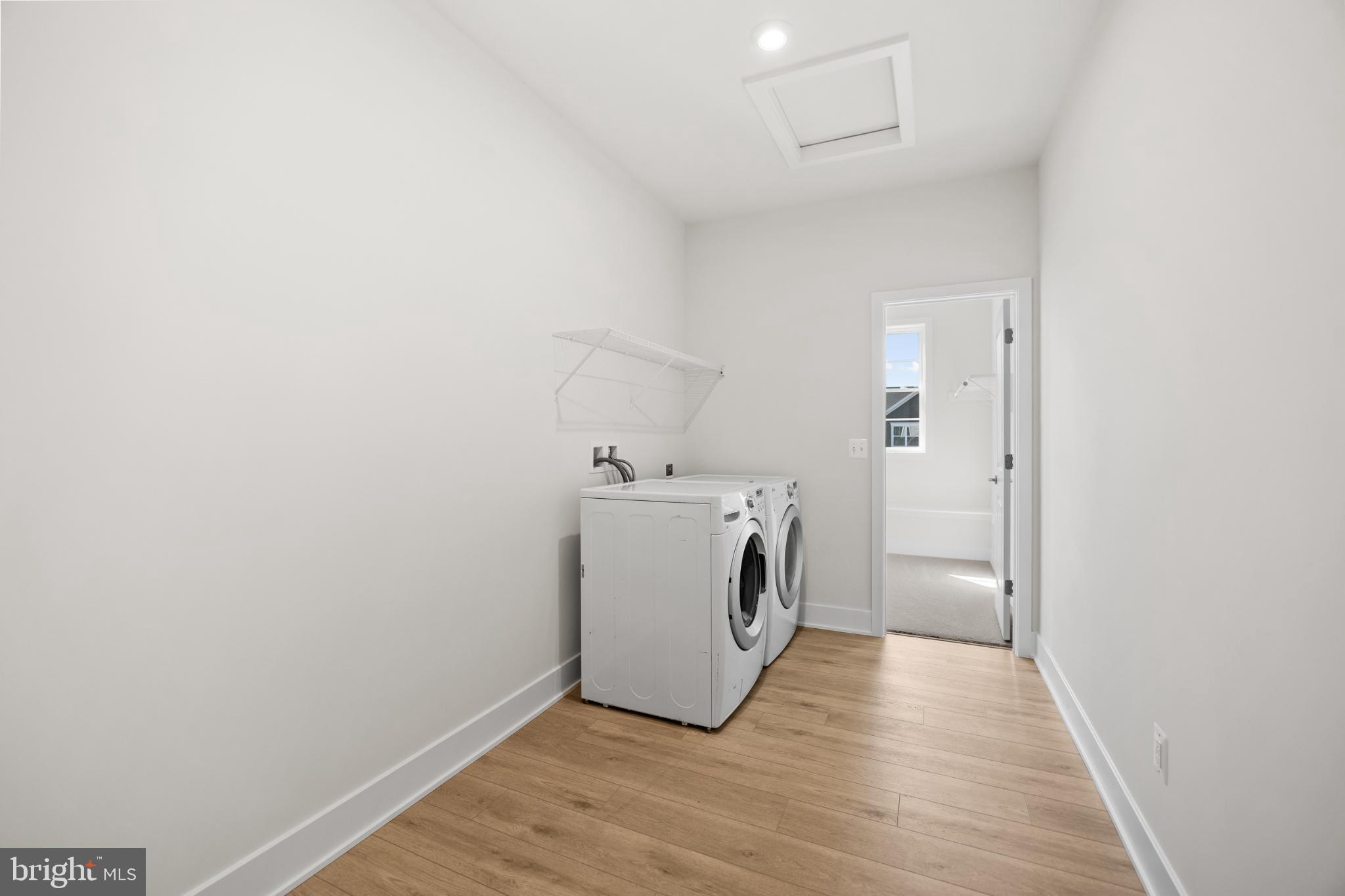 104 Alabaster Lane Stephenson, VA 22656 - Photo 36 of 41 a utility room with wooden floor washer and dryer