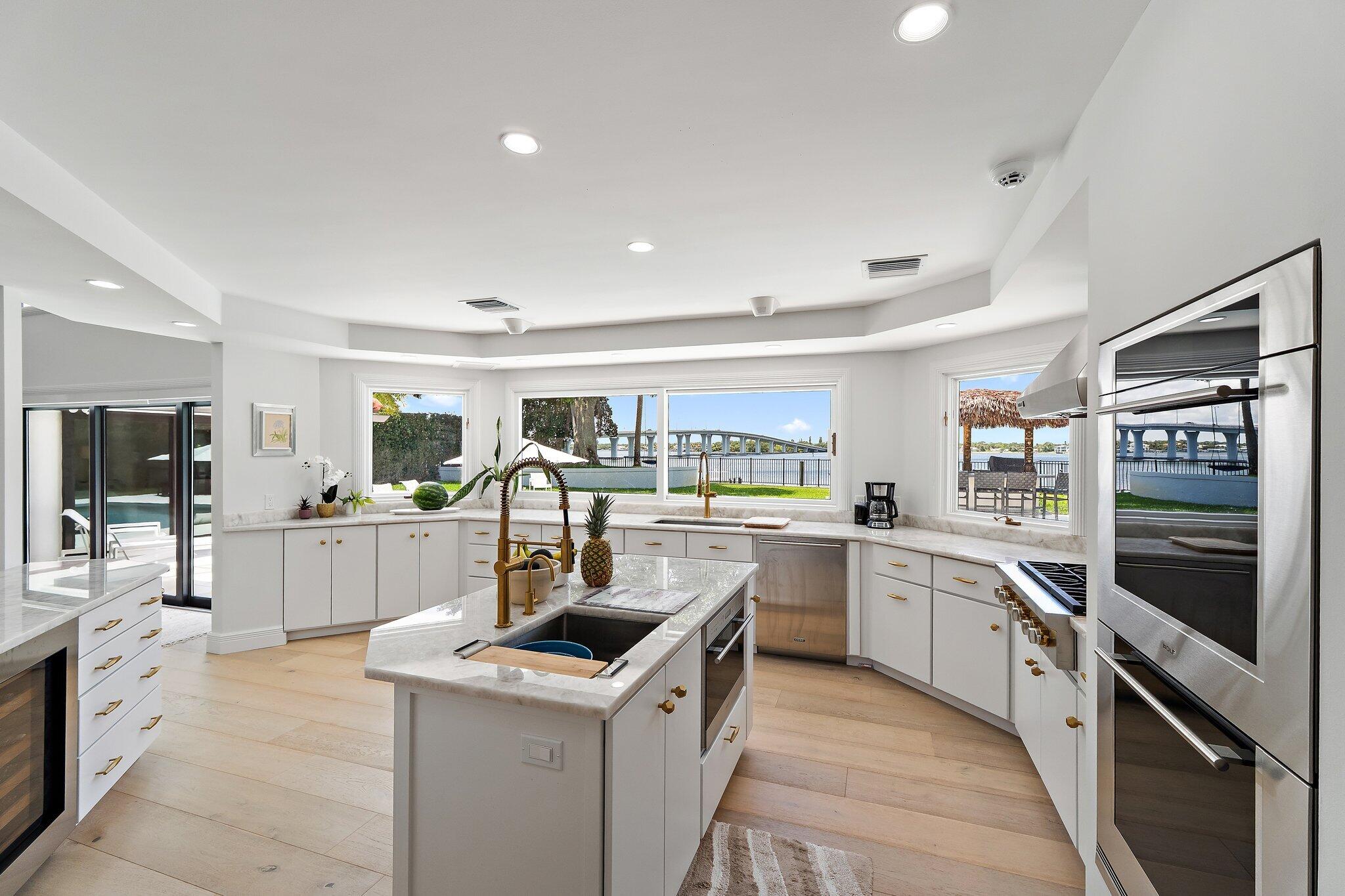 9 North River Road Stuart, FL 34996 - Photo 7 of 24 a kitchen with counter top space and appliances