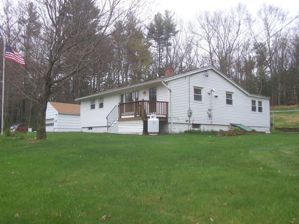 87 Waite Corner Road North Brookfield, MA 01535 - Photo 16 of 17 a view of a house with backyard and garden