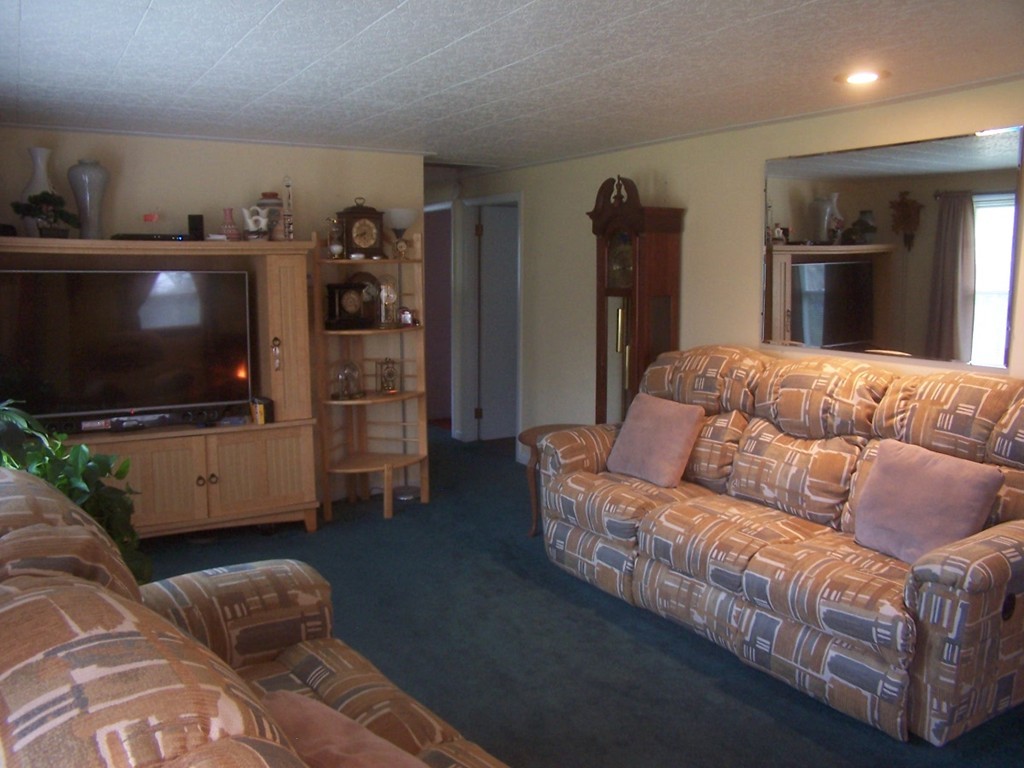 87 Waite Corner Road North Brookfield, MA 01535 - Photo 4 of 17 a living room with a couch and a flat screen tv