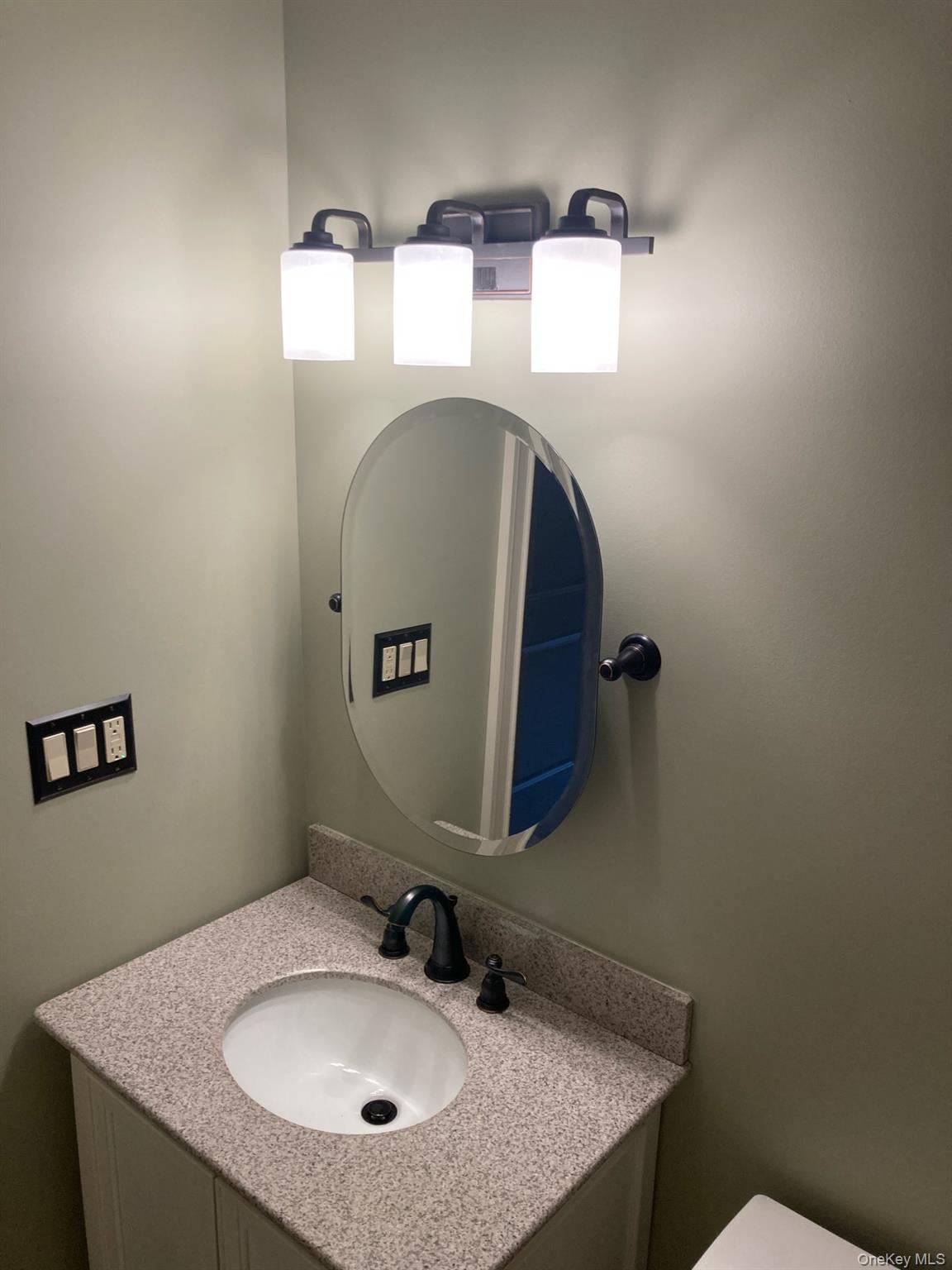 2 Colonial Road, Unit 126 Beacon, NY 12508 - Photo 8 of 11 Half bathroom with vanity and toilet