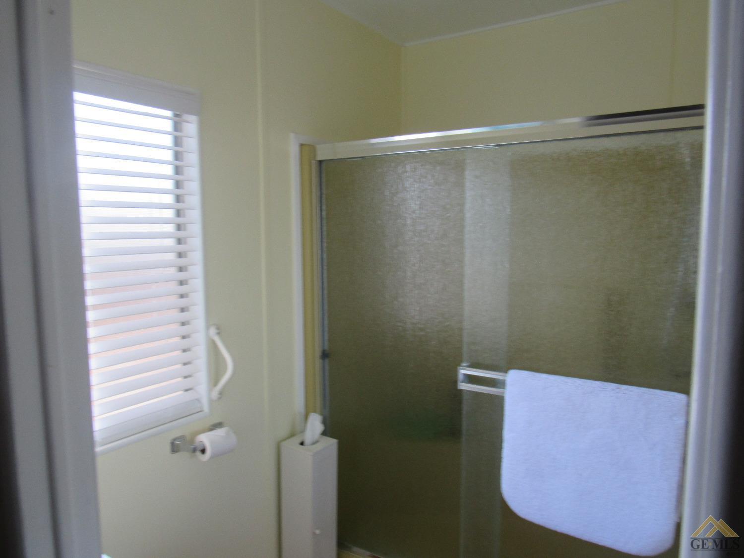 Undisclosed Address Bakersfield, CA 93308 - Photo 14 of 20 a bathroom with a shower