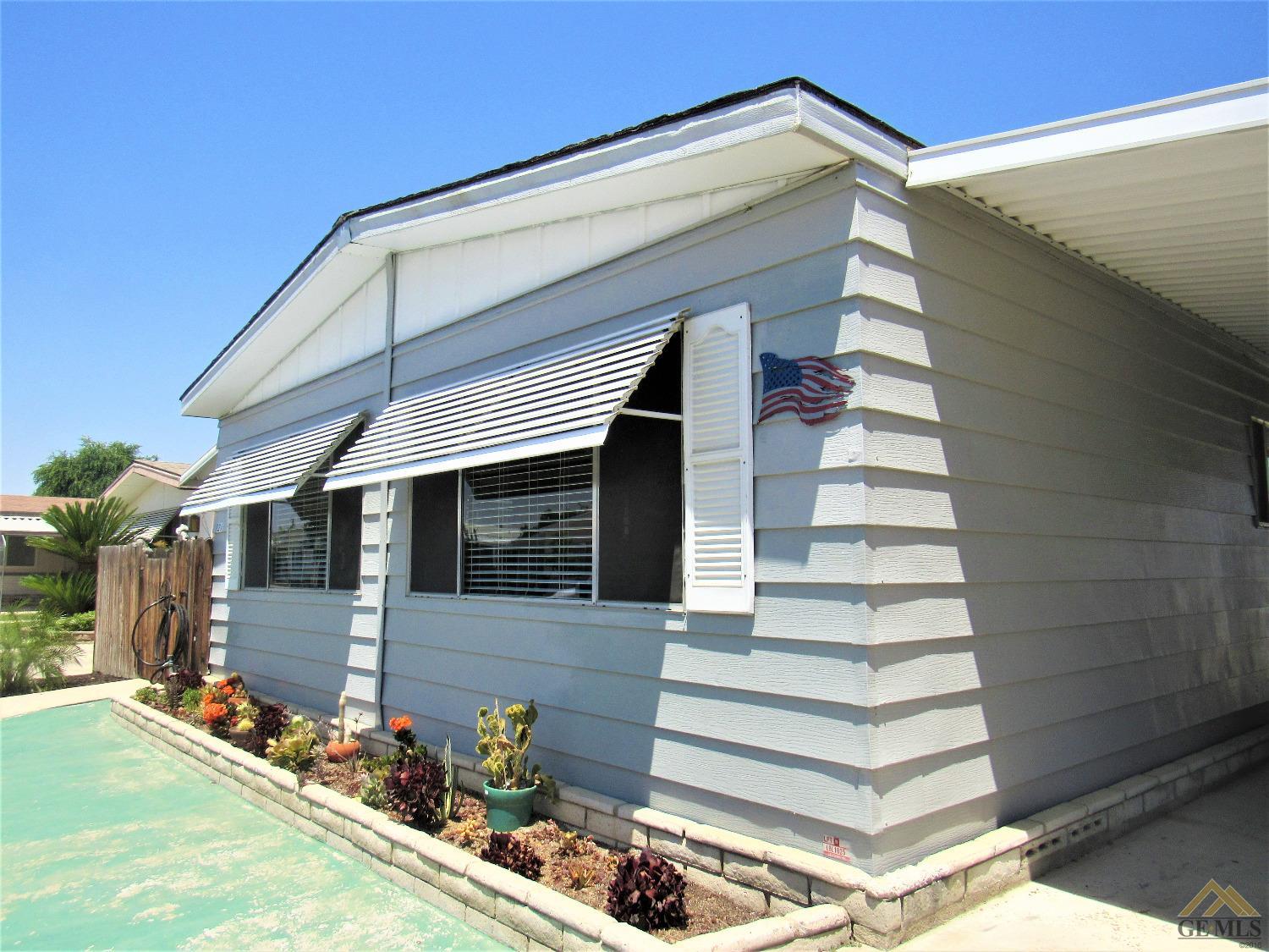 Undisclosed Address Bakersfield, CA 93308 - Photo 2 of 20 a view of a house with street