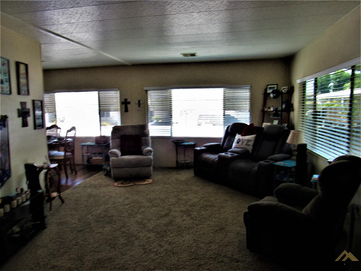 Undisclosed Address Bakersfield, CA 93308 - Photo 5 of 20 a living room with furniture and a large window