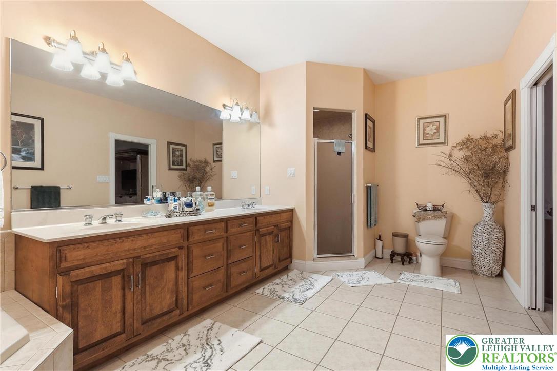 5217 Cider Press Road Schnecksville, PA 18078 - Photo 29 of 54 a spacious bathroom with a double vanity sink mirror and toilet