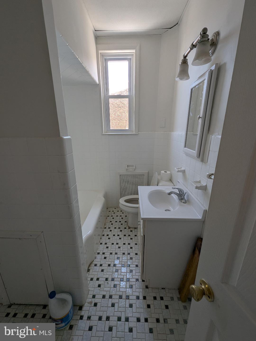 7158 Torresdale Avenue Philadelphia, PA 19135 - Photo 15 of 17 a bathroom with a sink toilet and shower