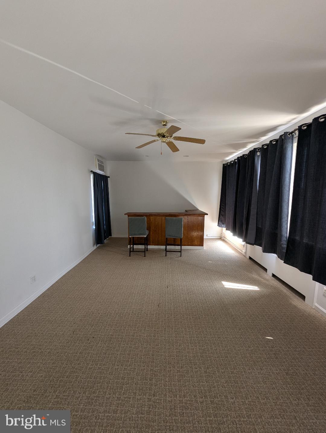 7158 Torresdale Avenue Philadelphia, PA 19135 - Photo 3 of 17 a view of a livingroom with a staircase and a ceiling fan