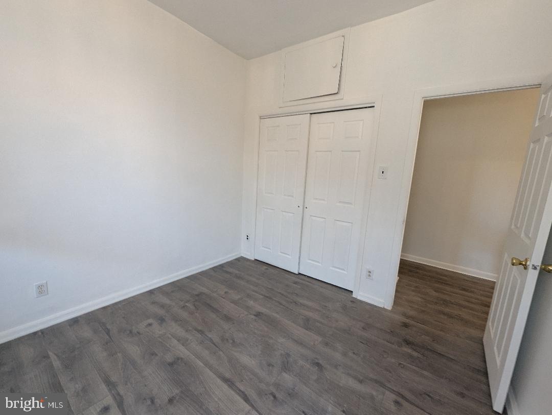 7158 Torresdale Avenue Philadelphia, PA 19135 - Photo 10 of 17 an empty room with wooden floor