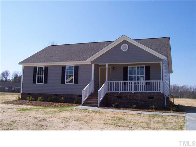 340 Ridge Road Angier, NC 27501 - Photo 1 of 7 Front of home with rocking chair front porch.