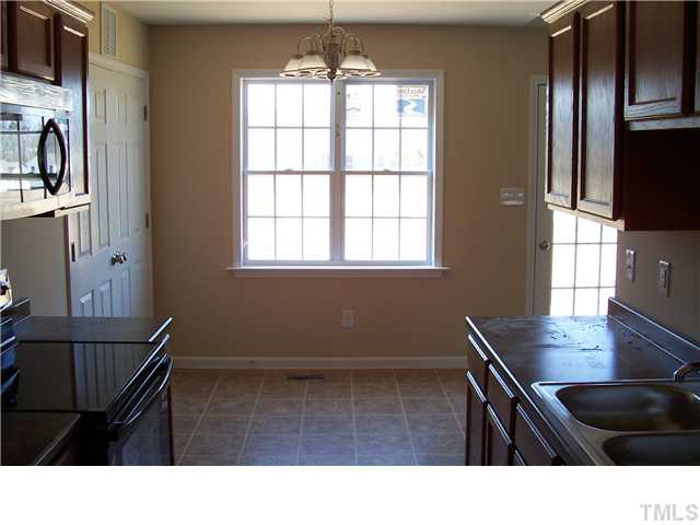 340 Ridge Road Angier, NC 27501 - Photo 5 of 7 Dining area with a double window that overlooks the back yard.