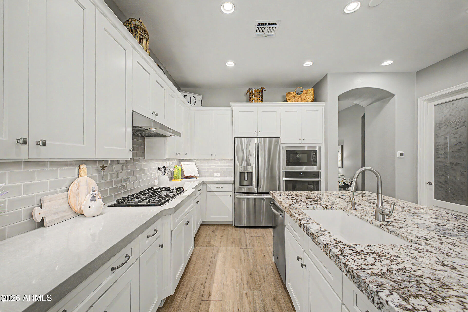 3560 East Appaloosa Road Gilbert, AZ 85296 - Photo 13 of 32 a kitchen with a sink stove and refrigerator