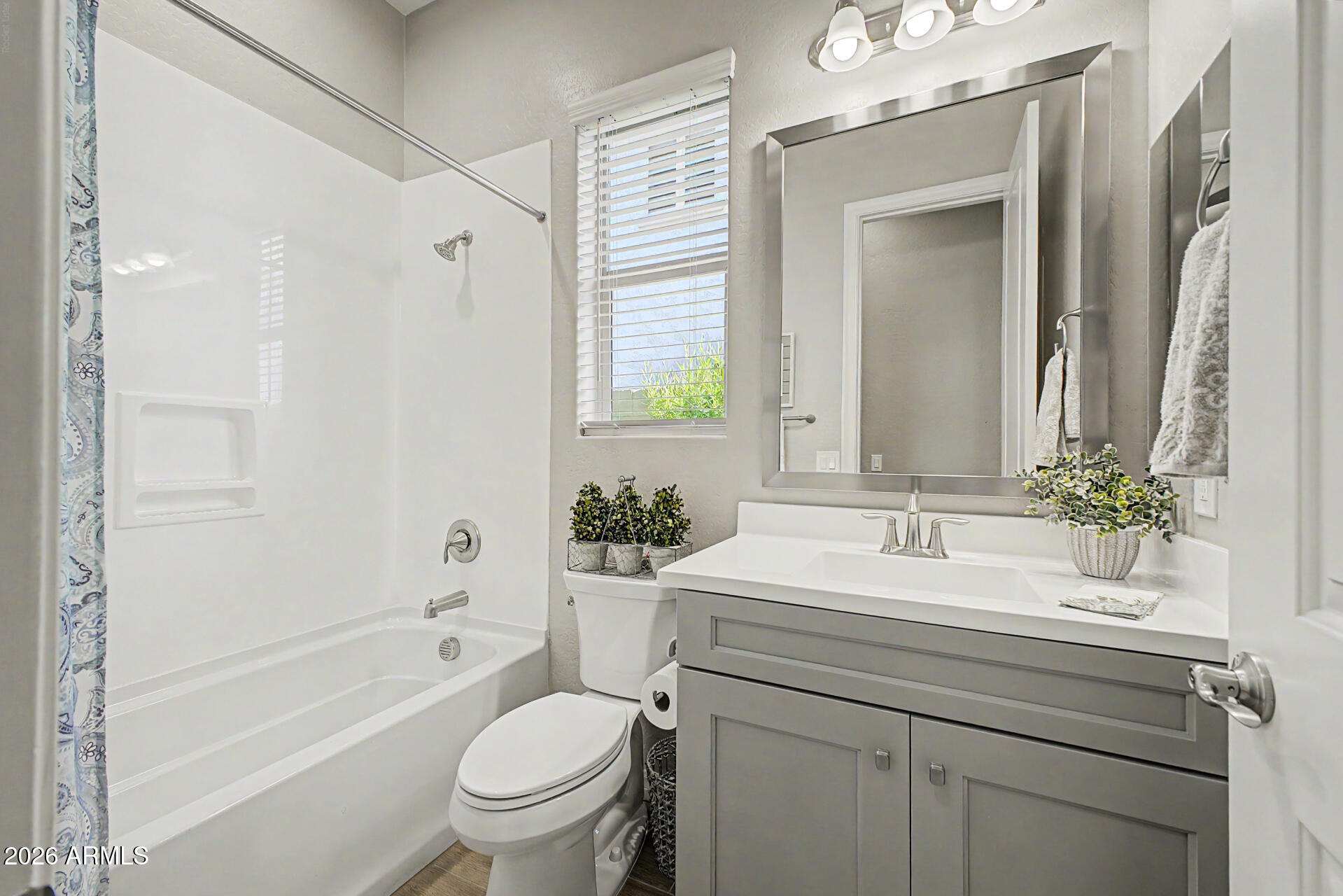 3560 East Appaloosa Road Gilbert, AZ 85296 - Photo 16 of 32 a bathroom with a granite countertop sink a toilet and a bathtub