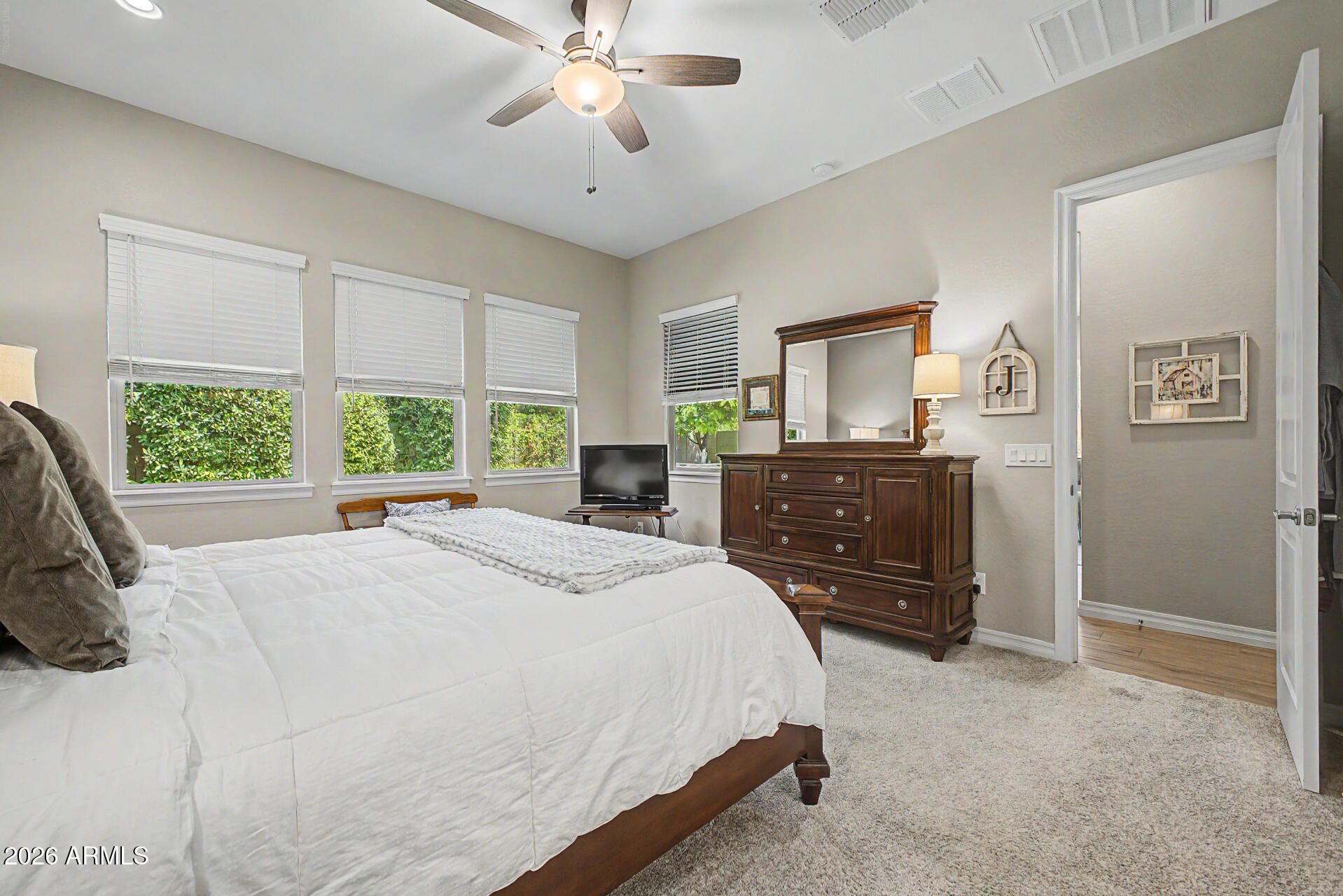 3560 East Appaloosa Road Gilbert, AZ 85296 - Photo 18 of 32 a spacious bedroom with a bed and a dresser