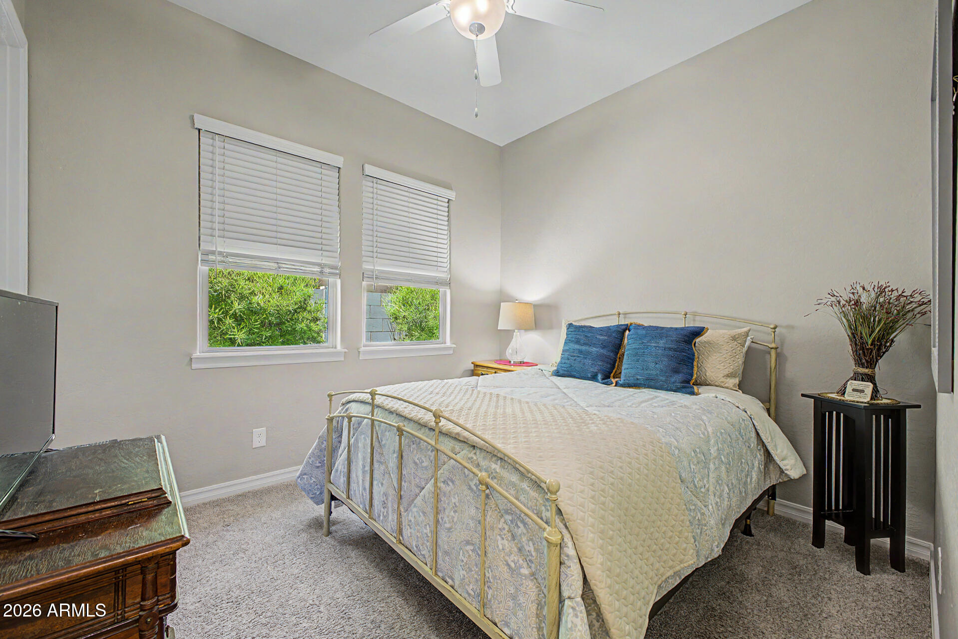 3560 East Appaloosa Road Gilbert, AZ 85296 - Photo 22 of 32 a bed sitting in a bedroom next to a window