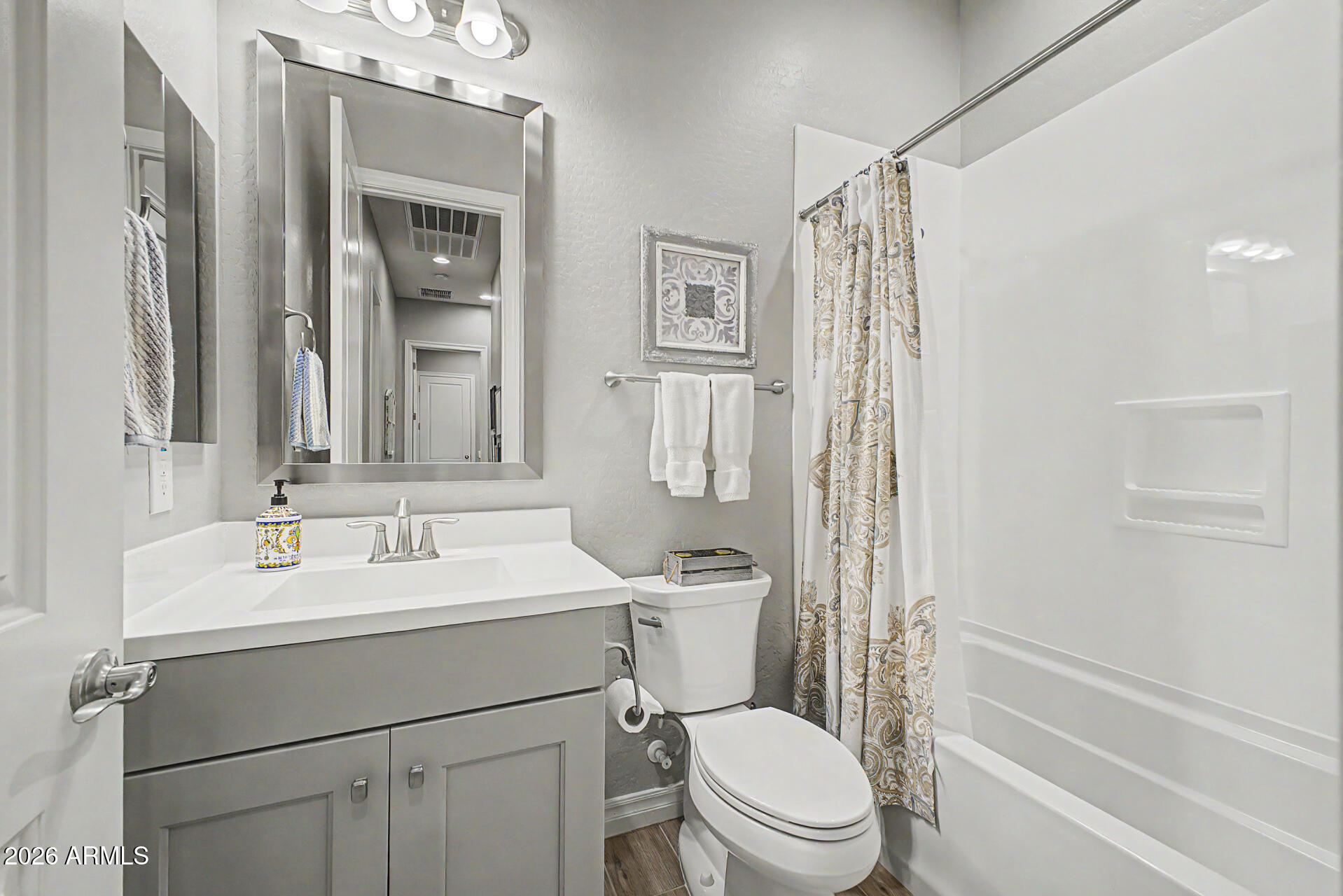 3560 East Appaloosa Road Gilbert, AZ 85296 - Photo 23 of 32 a bathroom with a sink a toilet a mirror a vanity and shower
