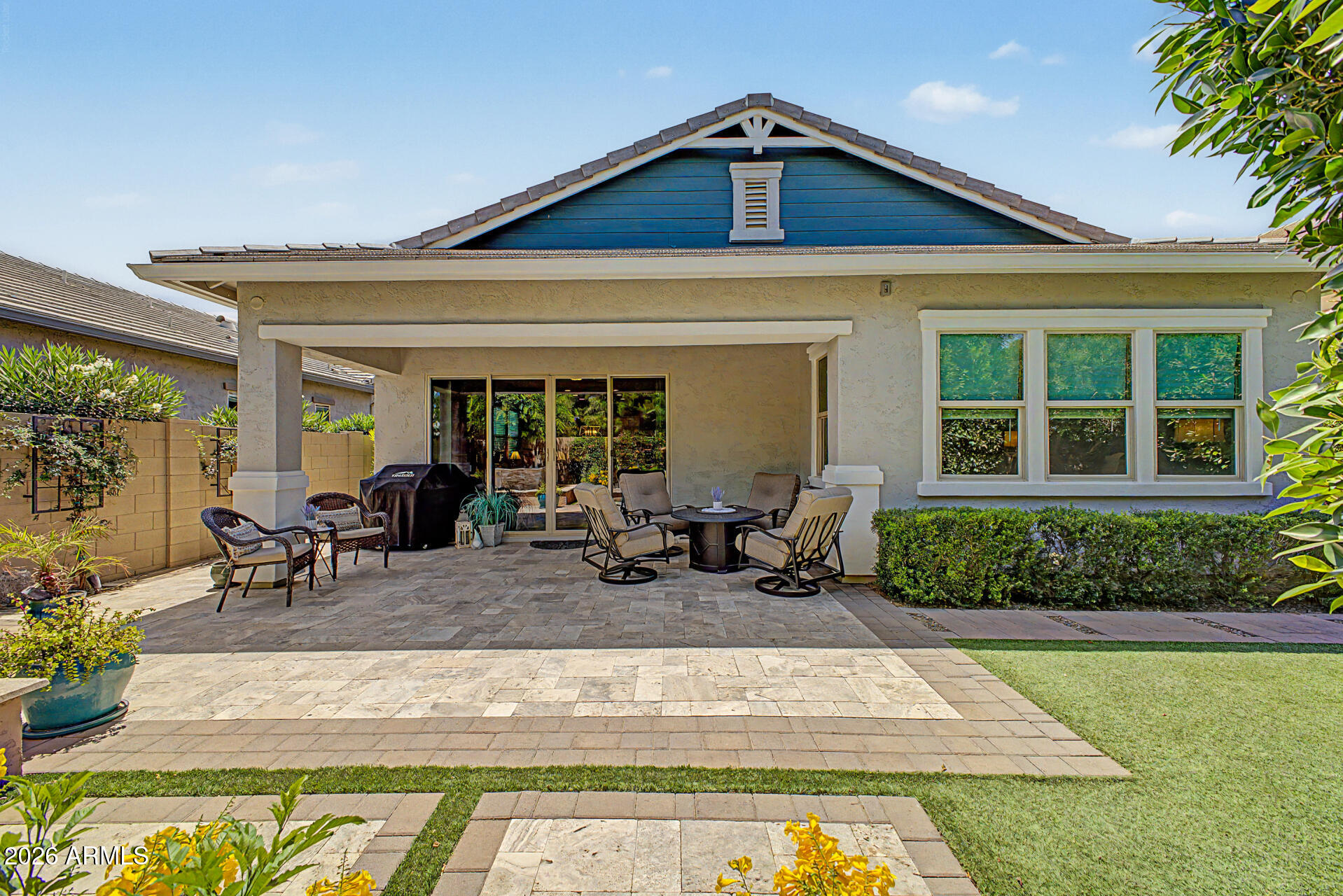 3560 East Appaloosa Road Gilbert, AZ 85296 - Photo 31 of 32 a view of a house with sitting area and garden