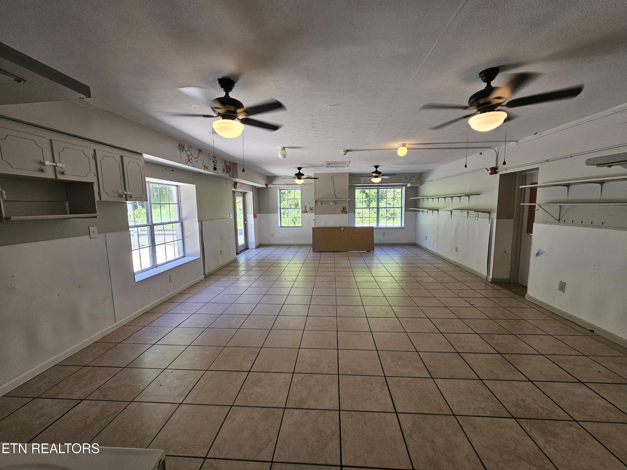 607 Old Tacora Hills Road Clinton, TN 37716 - Photo 16 of 47 a view of a kitchen with a stove cabinets and a kitchen