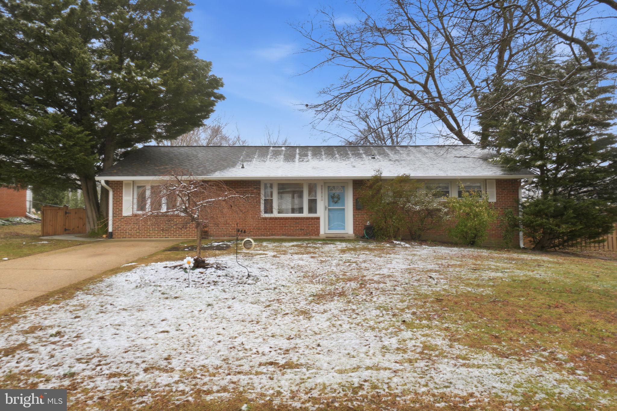7921 Foote Lane Springfield, VA 22151 - Photo 1 of 26 a front view of a house with a yard and garage