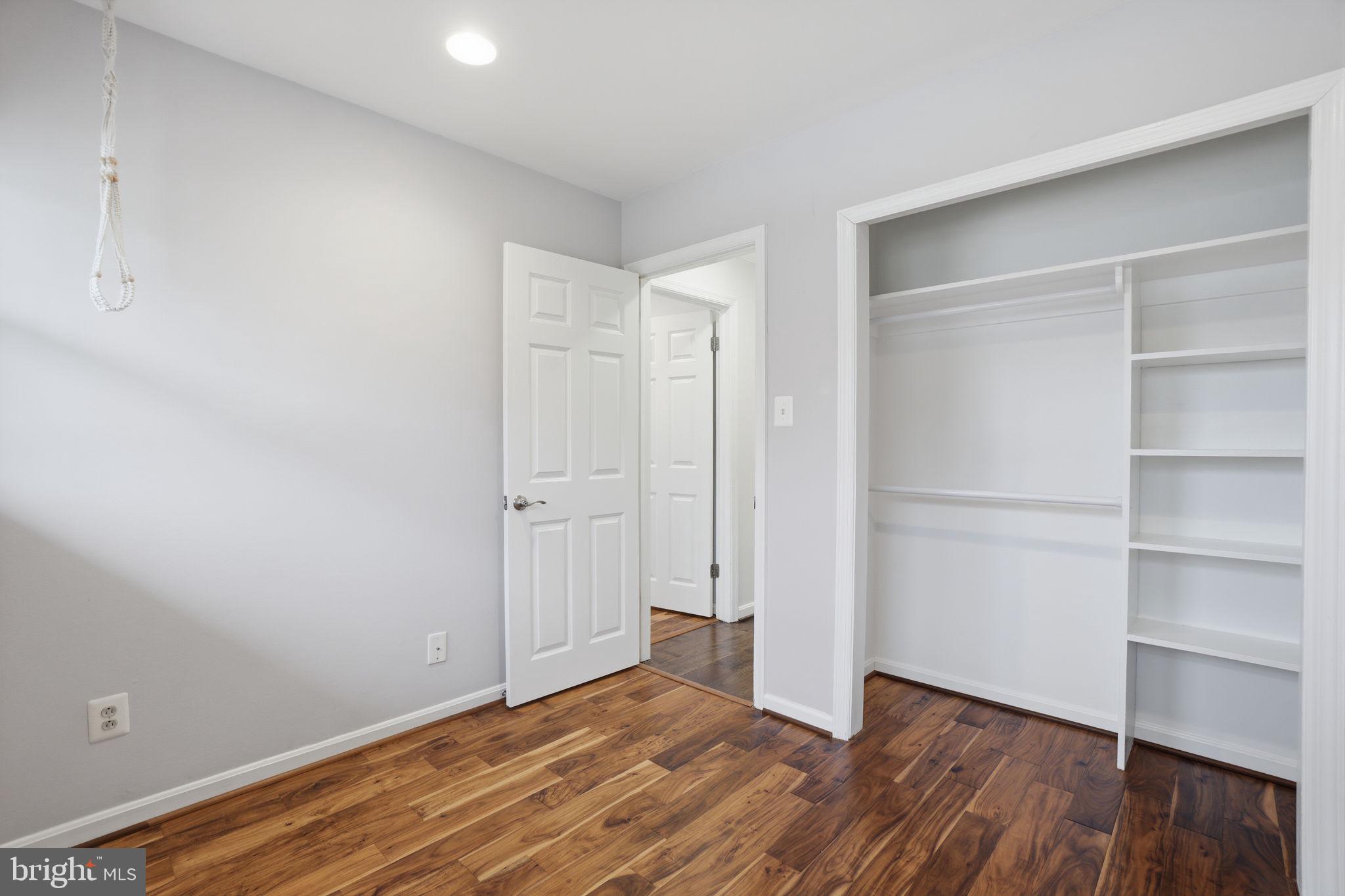 7921 Foote Lane Springfield, VA 22151 - Photo 13 of 26 a view of an empty room with wooden floor and closet