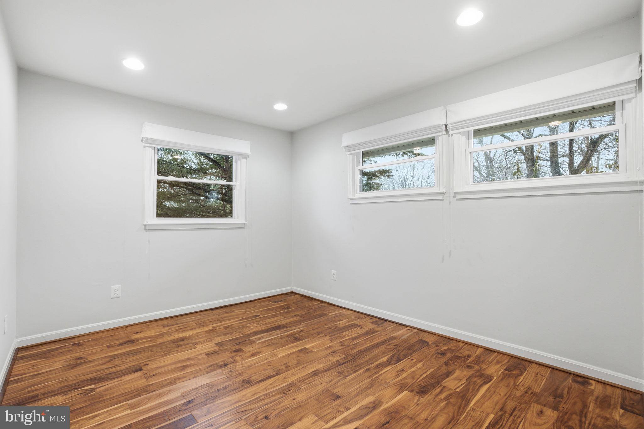 7921 Foote Lane Springfield, VA 22151 - Photo 17 of 26 a view of empty room with wooden floor and fan