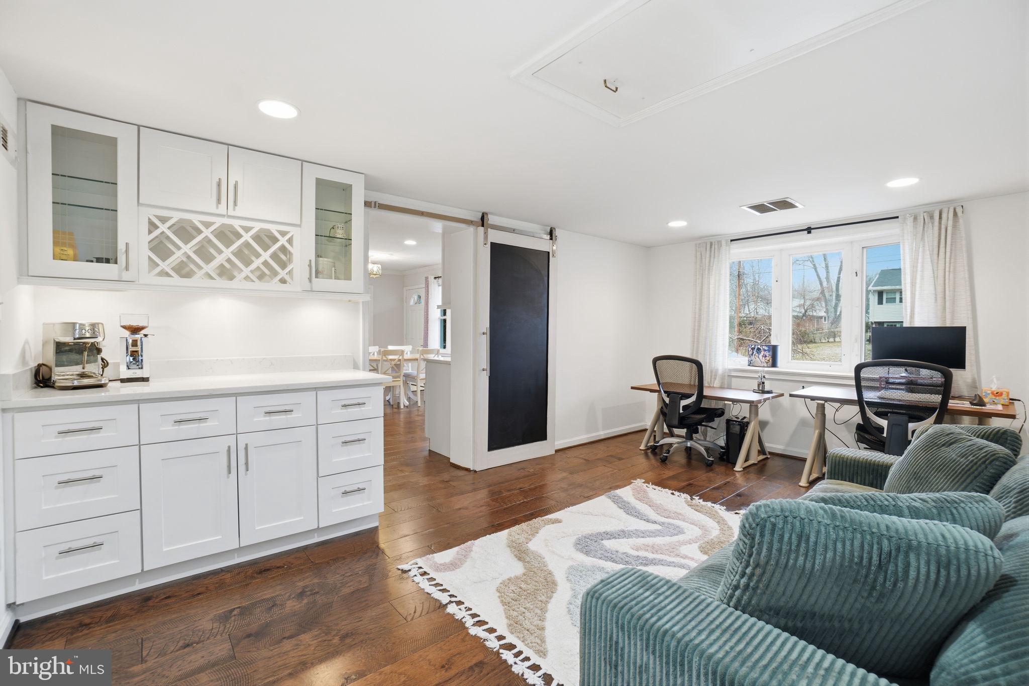 7921 Foote Lane Springfield, VA 22151 - Photo 18 of 26 a living room with furniture a rug and white walls