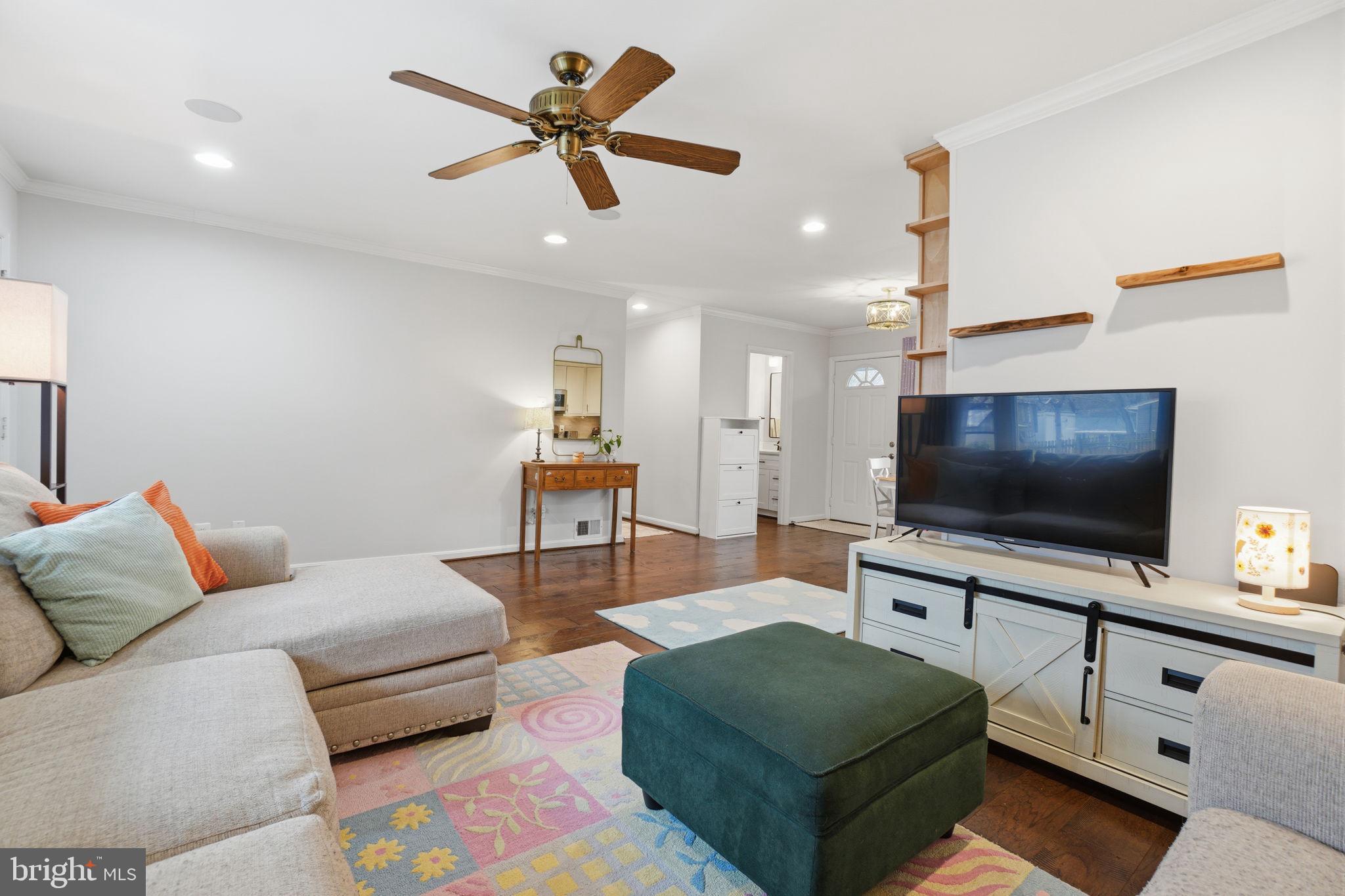 7921 Foote Lane Springfield, VA 22151 - Photo 19 of 26 a living room with furniture and a flat screen tv