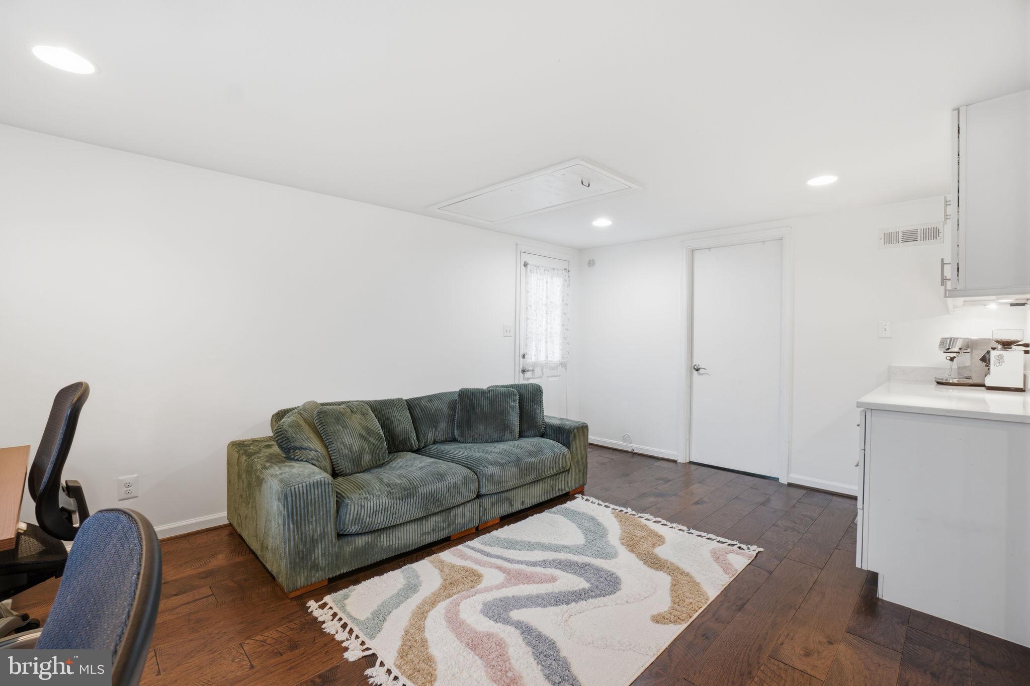 7921 Foote Lane Springfield, VA 22151 - Photo 20 of 26 a living room with furniture and a couch