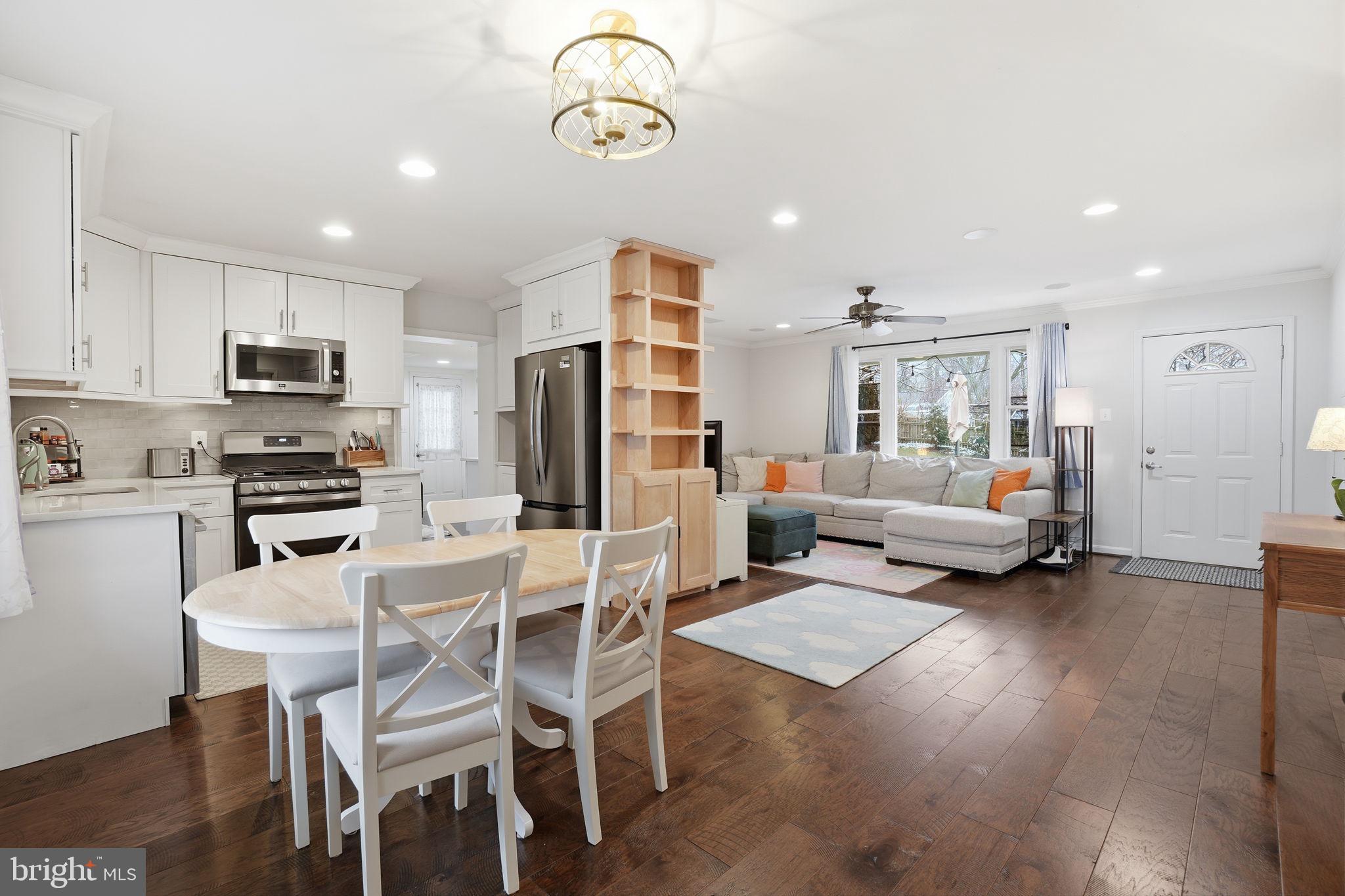 7921 Foote Lane Springfield, VA 22151 - Photo 2 of 26 a living room with stainless steel appliances furniture and a kitchen view