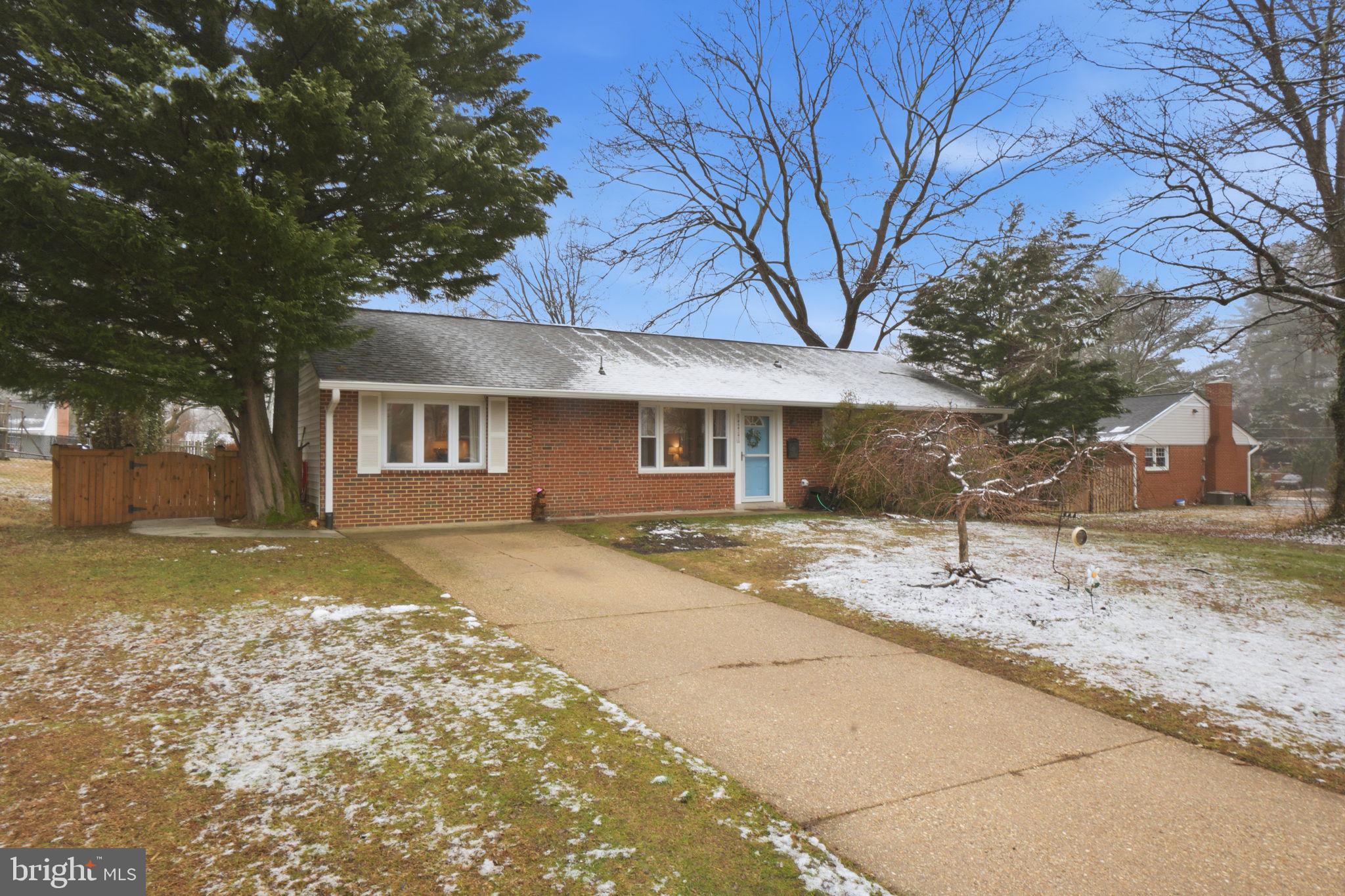 7921 Foote Lane Springfield, VA 22151 - Photo 23 of 26 a front view of a house with a yard and garage
