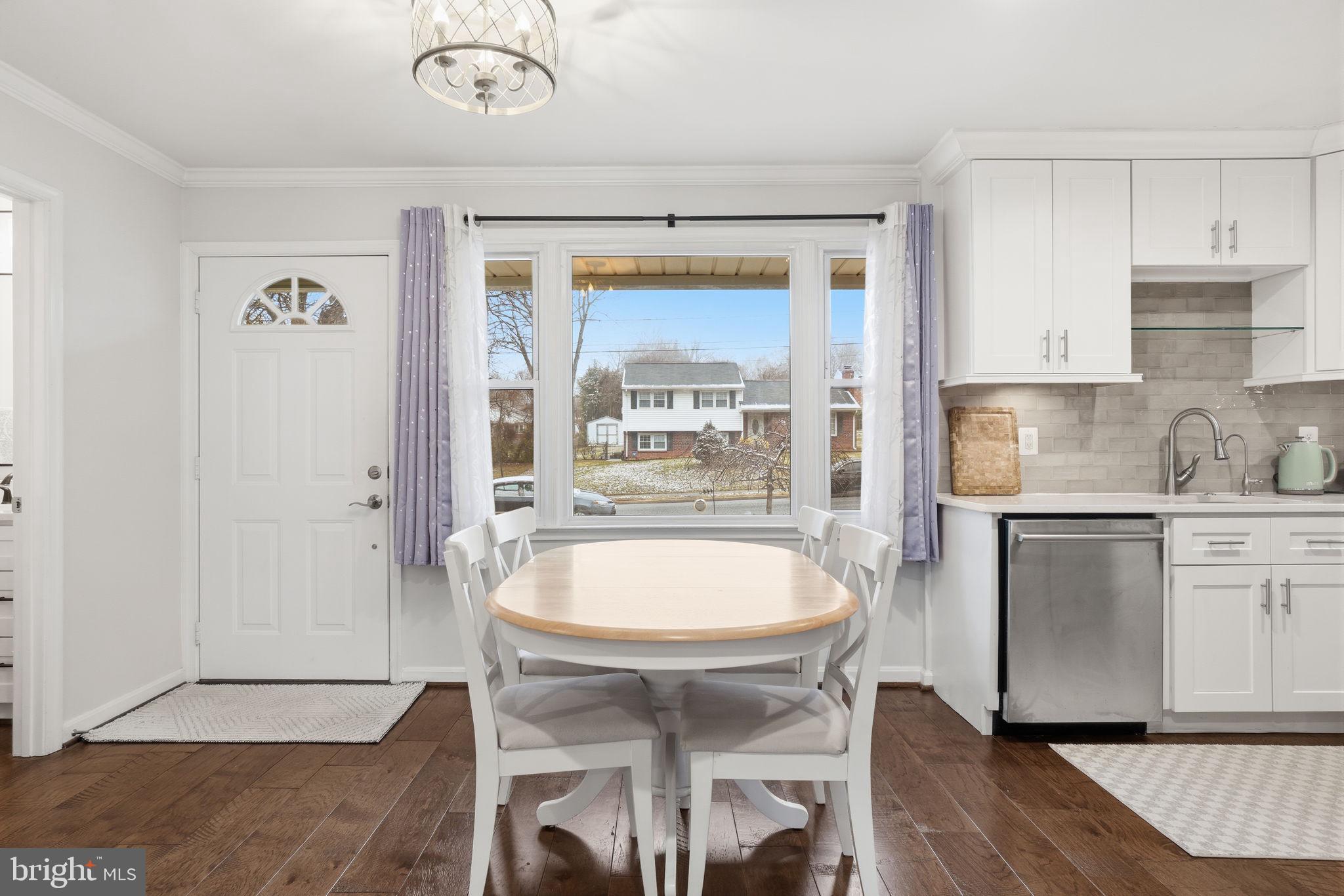 7921 Foote Lane Springfield, VA 22151 - Photo 7 of 26 a kitchen with a table and chairs in it